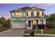 Inviting two-story home featuring a two-car garage, covered porch, and manicured landscaping at 123 Mcdonald Ct, Summerville, SC 29485