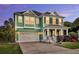 Charming two-story home featuring a covered porch, attached garage, and beautifully manicured landscaping at 123 Mcdonald Ct, Summerville, SC 29485