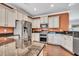 Contemporary kitchen featuring granite countertops, white cabinets, and stainless steel appliances for a sleek design at 123 Mcdonald Ct, Summerville, SC 29485