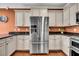 Beautiful kitchen featuring stainless steel refrigerator, granite countertops, and ample cabinet space, perfect for cooking and entertaining at 123 Mcdonald Ct, Summerville, SC 29485