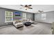Spacious living room with gray walls, carpet, and a comfortable sectional sofa, plus stylish ceiling fans at 123 Mcdonald Ct, Summerville, SC 29485