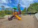 Colorful playground with slide, stairs, and swings set against a backdrop of trees at 123 Mcdonald Ct, Summerville, SC 29485
