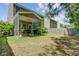 Spacious backyard with screened-in porch, lush greenery, and partial fence at 134 Longford Dr, Summerville, SC 29483