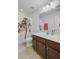 Cozy bathroom featuring a vanity with dark cabinets, a shower with decorative curtain and tile floor at 134 Longford Dr, Summerville, SC 29483