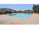 Community pool with seating surrounded by lush landscaping, creating a perfect spot for recreation and relaxation at 134 Longford Dr, Summerville, SC 29483