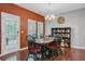 Formal dining room with hardwood floors, modern chandelier, and access to outdoor patio at 134 Longford Dr, Summerville, SC 29483