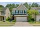 Traditional two-story home with brick accents, landscaped yard, and a two-car garage at 134 Longford Dr, Summerville, SC 29483