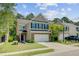 Two-story home with brick facade, attached garage, and well-maintained lawn and landscaping at 134 Longford Dr, Summerville, SC 29483