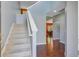 Bright foyer with hardwood floors, staircase and views of the dining area at 134 Longford Dr, Summerville, SC 29483