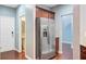 Well-lit kitchen area with stainless steel refrigerator and access to the adjacent rooms at 134 Longford Dr, Summerville, SC 29483