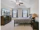 Spacious bedroom with a queen-sized bed, television, large windows and natural light at 134 Longford Dr, Summerville, SC 29483