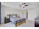 Spacious bedroom with a queen-sized bed, large windows, ceiling fan, and closet access at 134 Longford Dr, Summerville, SC 29483