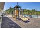 The playground features a slide and climbing area, with the community pool in the background at 134 Longford Dr, Summerville, SC 29483
