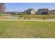 Picturesque view of a calm pond graced by ducks, adding to the neighborhood's peaceful ambiance at 134 Longford Dr, Summerville, SC 29483