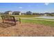 Charming community pond with a bench, perfect for enjoying serene water views and relaxing outdoors at 134 Longford Dr, Summerville, SC 29483