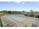 A large outdoor pool features lounge chairs, fenced-in playground, and pergola-covered seating at 134 Longford Dr, Summerville, SC 29483