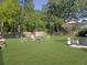 Spacious backyard with a fire pit, seating, and lush green lawn at 139 Pointer Dr, Goose Creek, SC 29445
