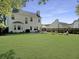 Expansive backyard with a patio, fire pit, and lush green lawn at 139 Pointer Dr, Goose Creek, SC 29445