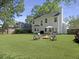 A spacious backyard offers relaxation and outdoor entertainment with a fire pit at 139 Pointer Dr, Goose Creek, SC 29445