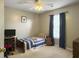 Cozy bedroom with a comfortable bed, guitar, and window with blue curtains at 139 Pointer Dr, Goose Creek, SC 29445