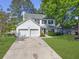 Charming two-story home featuring a two-car garage and well-manicured lawn at 139 Pointer Dr, Goose Creek, SC 29445