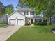 Charming two-story home featuring a two-car garage and well-manicured lawn at 139 Pointer Dr, Goose Creek, SC 29445