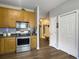 Kitchen with stainless steel appliances, wood cabinets, hardwood floors, and a pantry at 139 Pointer Dr, Goose Creek, SC 29445