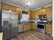 Modern kitchen featuring stainless steel appliances, wood cabinets, and a hardwood floor at 139 Pointer Dr, Goose Creek, SC 29445