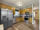 Modern kitchen featuring stainless steel appliances, wood cabinets, and a hardwood floor at 139 Pointer Dr, Goose Creek, SC 29445