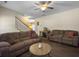Relaxing living room with comfortable seating, ceiling fan, and a view leading to the staircase and dining area at 139 Pointer Dr, Goose Creek, SC 29445