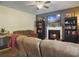 Comfortable living room with a fireplace, built-in bookcases and ceiling fan at 139 Pointer Dr, Goose Creek, SC 29445