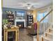 Living room with fireplace, hardwood floors, built-in bookcases and stairs leading to the upper floor at 139 Pointer Dr, Goose Creek, SC 29445