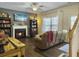 Cozy living room with fireplace, hardwood floors, and access to the backyard at 139 Pointer Dr, Goose Creek, SC 29445