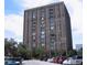 Exterior view of a tall building with a parking lot and lots of windows at 14 Lockwood Dr # 2E, Charleston, SC 29401