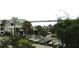 Exterior view of a building near the water featuring well-maintained landscaping at 14 Lockwood Dr # 2E, Charleston, SC 29401
