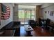 A cozy living room featuring hardwood floors and a large window with natural light at 14 Lockwood Dr # 2E, Charleston, SC 29401