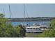 Beautiful water view from trees including sailboats, bridge, and landscape in the distance at 14 Lockwood Dr # 2E, Charleston, SC 29401