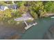 An aerial view of a home community with a boat dock along the waterfront at 1470 Eutaw Battalion Dr, Charleston, SC 29412