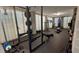 Home gym with exercise equipment, including a weight rack, bench, punching bag, and rowing machine at 1470 Eutaw Battalion Dr, Charleston, SC 29412
