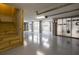 Spacious basement with epoxy flooring and wooden stairs, ready for finishing or storage at 1470 Eutaw Battalion Dr, Charleston, SC 29412