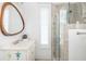 Bright bathroom features stylish vanity, framed mirror, and glass shower stall at 1470 Eutaw Battalion Dr, Charleston, SC 29412