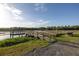 Community dock featuring wood decking, a covered bench, and a ramp to the waterway at 1470 Eutaw Battalion Dr, Charleston, SC 29412