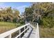Picturesque view from wooden boardwalk and community pier surrounded by lush greenery at 1470 Eutaw Battalion Dr, Charleston, SC 29412