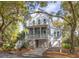 Charming two-story home with a welcoming porch, garage, set amongst lush greenery in a serene neighborhood at 1470 Eutaw Battalion Dr, Charleston, SC 29412