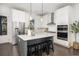 Open concept kitchen featuring an island, stainless appliances, and eat-in bar at 1470 Eutaw Battalion Dr, Charleston, SC 29412