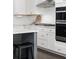 Bright kitchen with gas range and double ovens with stainless steel hardware and hood at 1470 Eutaw Battalion Dr, Charleston, SC 29412