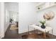 Bright office space with white desk, floating shelves, and doorway to dining room at 1470 Eutaw Battalion Dr, Charleston, SC 29412