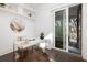 Bright office features white desk, floating shelves and sliding door to a balcony at 1470 Eutaw Battalion Dr, Charleston, SC 29412