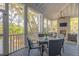 Relax on the screened-in porch with comfortable seating and beautiful views at 1470 Eutaw Battalion Dr, Charleston, SC 29412