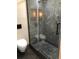 Modern bathroom featuring a glass shower with marble tile and pebble floor at 1496 Cypress Pointe Dr, Mount Pleasant, SC 29466